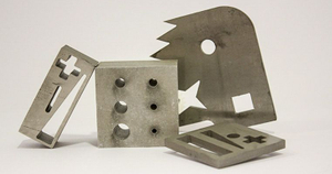 Several metals cut in various shapes using waterjet cutting